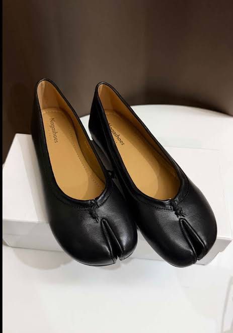 Nagashoes Black Tabi Ballet Flats Size 38 (Category: Flats & Sandals) located in Manila. Submitted by karely (Listing ID 1467247142, Image 1). Description: - Brand: Nagashoes - Size: 38 (24cm) - Color: Black with tan lining - Material: Smooth faux leather upper with textured rubber sole - Design: Split-toe detail with a small front knot accent - Condition: clean insoles, worn once with box RFS: doesnt fit me im size 23.5cm.