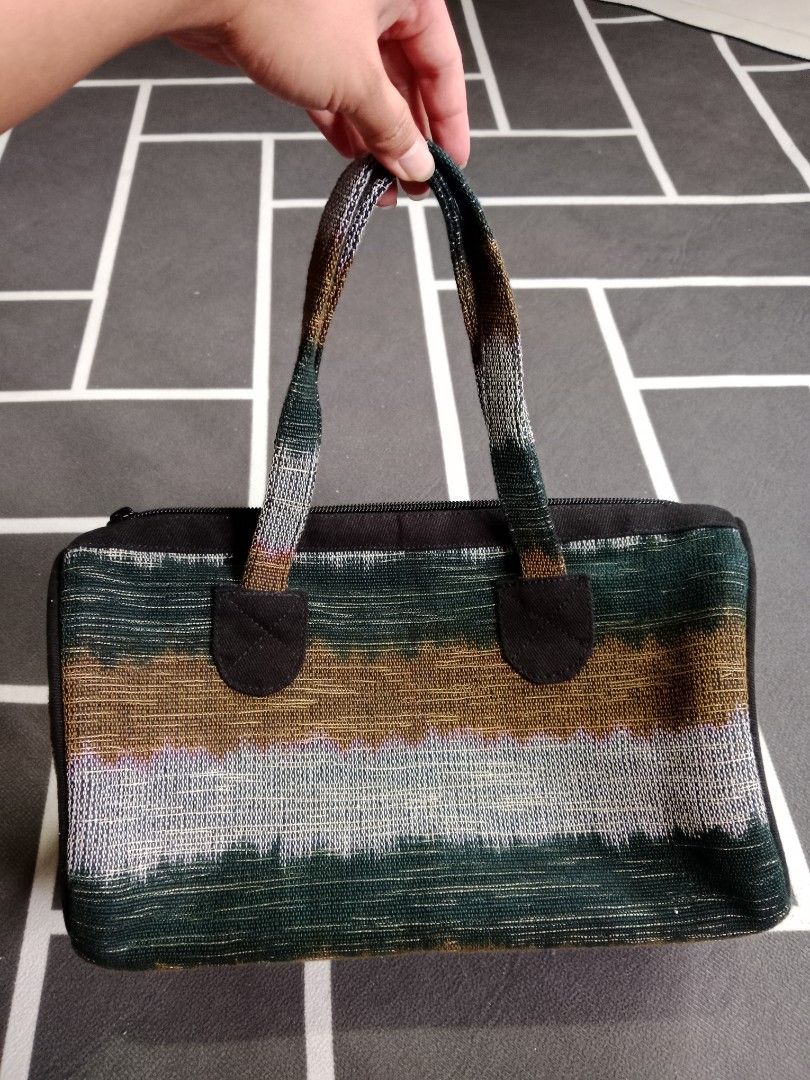 Narda's Original Ikat Handbag (Category: Shoulder Bags) located in Baguio. Submitted by jooeeeyyyy_ (Listing ID 1467272087, Image 1). Description: - Authentic Narda's handmade ikat handbag - Beautiful handwoven textile in earthy greens, greys, and warm tones - Secure zip top closure with comfortable black fabric straps - Clean interior lining with original brand patch.