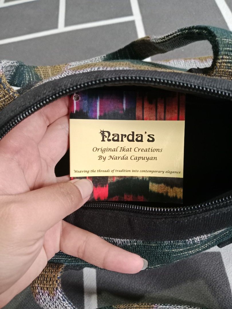 Narda's Original Ikat Handbag (Category: Shoulder Bags) located in Baguio. Submitted by jooeeeyyyy_ (Listing ID 1467272087, Image 3). Description: - Authentic Narda's handmade ikat handbag - Beautiful handwoven textile in earthy greens, greys, and warm tones - Secure zip top closure with comfortable black fabric straps - Clean interior lining with original brand patch.