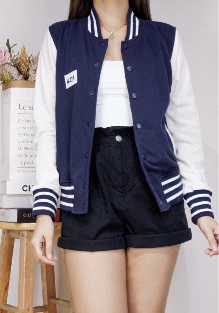 Navy Blue and White Varsity Jacket (Category: Coats, Jackets and Outerwear) located in Marikina City. Submitted by jessylady10 (Listing ID 1467285148, Image 1). Description: Classic navy blue college jacket with contrasting white sleeves and striped ribbed details. A versatile, easy-to-layer button-up outerwear piece perfect for cooler days. Gcash payment, lalamove delivery. S-M.