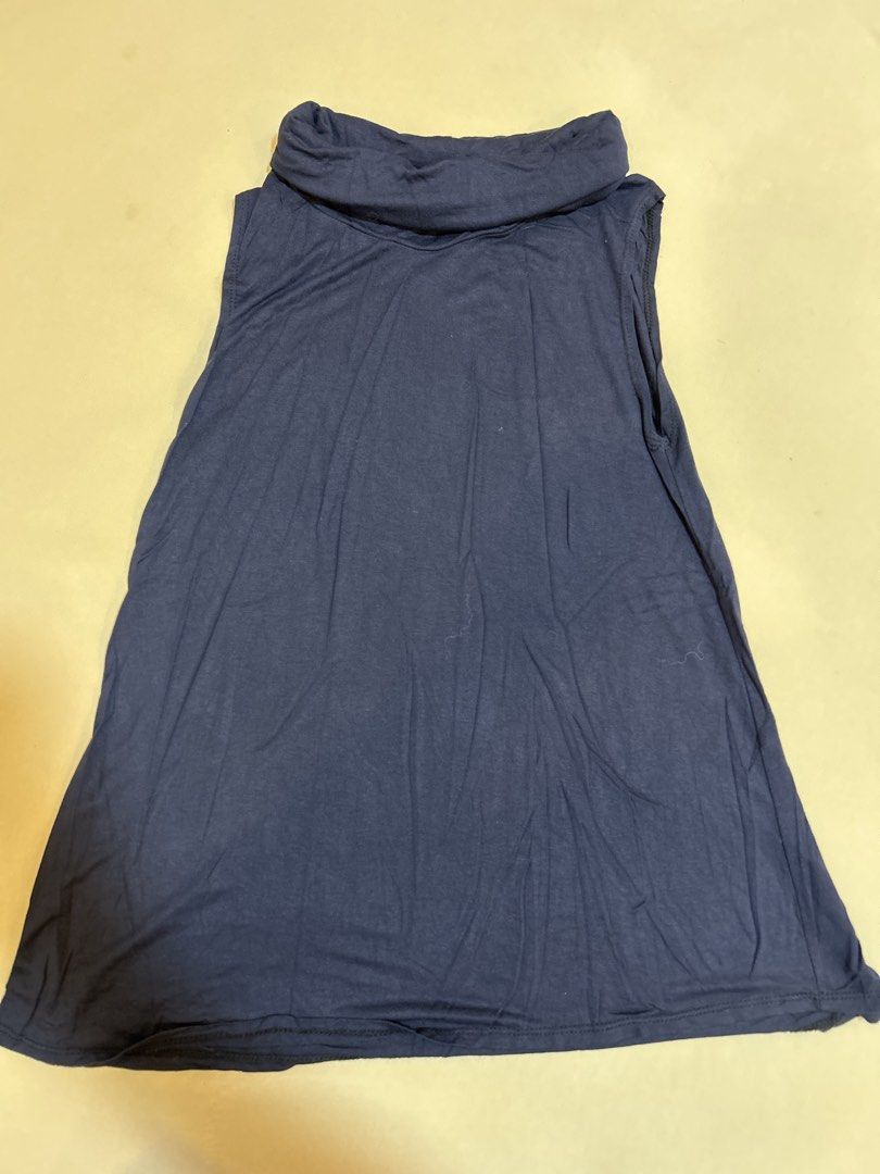 Navy blue sleeveless cowl neck top (Category: Sleeveless) located in Quezon City. Submitted by kyokoaman (Listing ID 1467307402, Image 2). Description: Dark blue sleeveless top with a draped cowl neckline. Soft fabric, relaxed fit through the body. Basic piece, easy to layer under cardigans or jackets. Casual everyday wear. Wrinkled from storage, needs a quick iron before wearing..