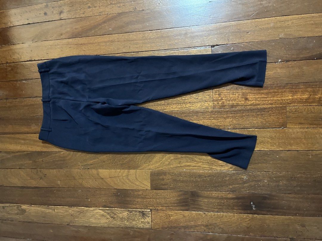 Navy Blue Tailored Dress Pants (Category: Other Bottoms) located in Quezon City. Submitted by silverriver_3cf939 (Listing ID 1467230628, Image 2). Description: - Color: Navy Blue - Cut: Straight leg with sharp front pleats - Details: Clean waistband with belt loops, front and back pockets - Fabric: Smooth, professional finish - Ideal for: Office wear, interviews, and formal events 27 waist.
