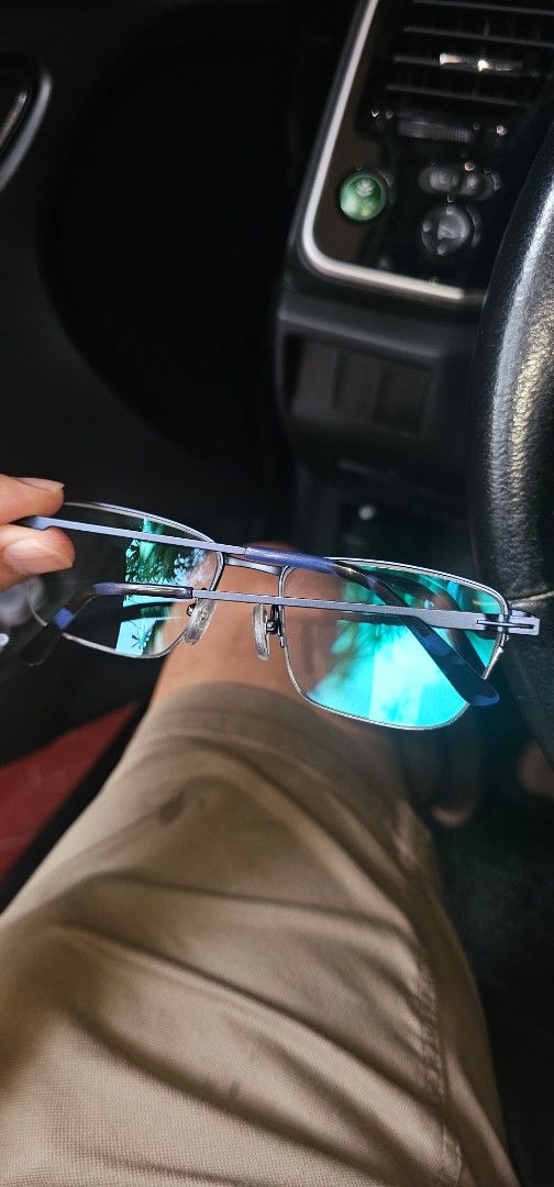 Navy Blue Titanium Eyeglass Frames (Category: Sunglasses & Eyewear) located in Manila. Submitted by anthonylee23810 (Listing ID 1467332522, Image 3). Description: - Color: Navy blue frames with clear lenses - Shape: Classic rectangular with sleek metal arms - Comfort: Features clear nose pads and standard temple measurements - Weight: Lightweight build for everyday wear.