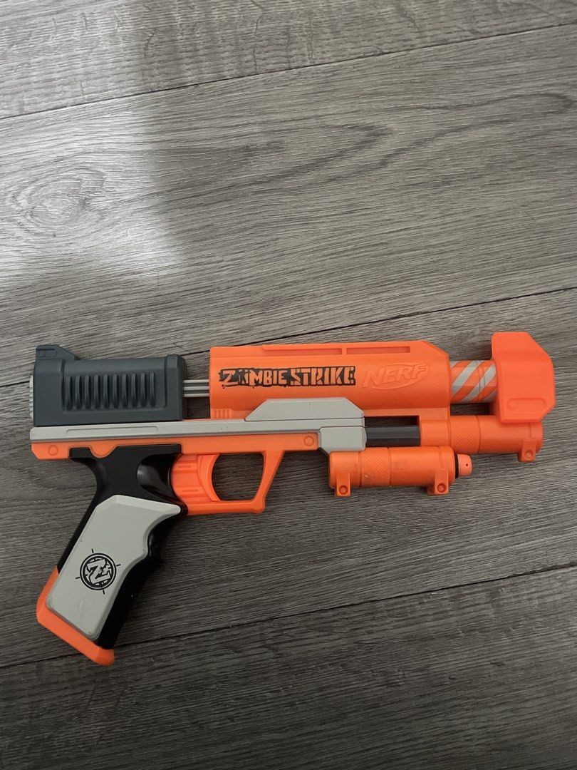 Nerf Zombie Strike Blaster Gun (Category: Action & Battle Toys) located in Pasig City. Submitted by md24c (Listing ID 1467176449, Image 1). Description: - no issues - comes with 2 black nerf darts - price is negotiable.