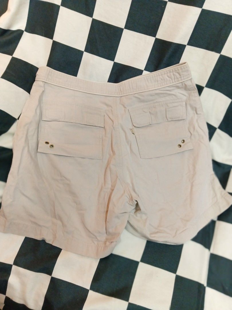 New Man Beige Cargo Shorts (Category: Shorts) located in Manila. Submitted by cami1914 (Listing ID 1467328296, Image 2). Description: - Brand: New Man - Color: Neutral beige - Material: Sturdy cotton fabric - Closure: Zip fly and button - Pockets: Multiple back pockets with button details - Style: Great for casual everyday wear or outdoor activities.
