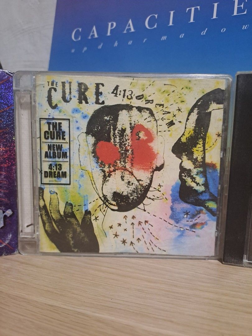 New Wave! CD (Category: CDs & DVDs) located in Las Pinas. Submitted by cobieshop (Listing ID 1467317919, Image 1). Description: - Artist & Album: The Cure - 4:13 Dream CD-P500 -SIOUXSIE & THE BANSHEES -Stargazer -P400 -DEPECHE MODE -Speak & Spell -P500 - Format: Standard jewel case with colourful abstract face artwork - Condition: Normal shelf wear on the clear plastic case; disc plays great - Perfect for: Alternative rock fans and music collecto