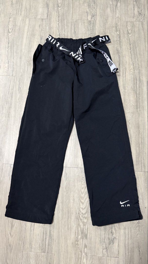 Nike Air Black Nylon Cargo Pants Size M (Category: Joggers) located in Caloocan City. Submitted by kobeeeee_12 (Listing ID 1467226199, Image 1). Description: - Brand: Nike - Color: Black - Size: Medium (Men's/Unisex) - Material: 100% Nylon - Waistband: Elastic with printed branded belt detail - Pockets: Convenient side pockets - Branding: Small Nike Air logo graphic near the left ankle hem - Origin: Made in Vietnam - Condition: Excellent / Ready 