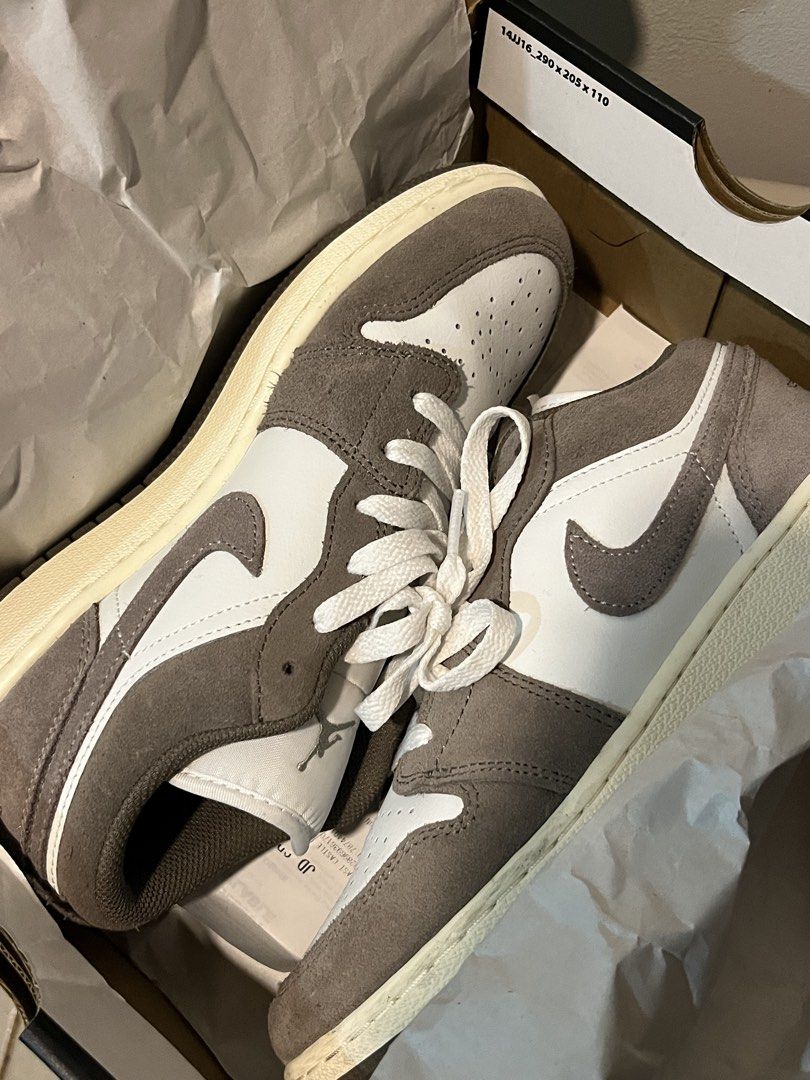 Nike Air Jordan 1 Low (Category: Sneakers) located in Consolacion. Submitted by everythingispreloved_ (Listing ID 1467347093, Image 1). Description: - Model: Jordan 1 Low - Material: Brown and white suede - Details: White laces, matching midsole, toe box, and side panels with dark brown overlays and swoosh - Packaging: Original black Jordan box with gold jumpman logo on the lid - Condition: Ready to wear, classic streetwear kicks.
