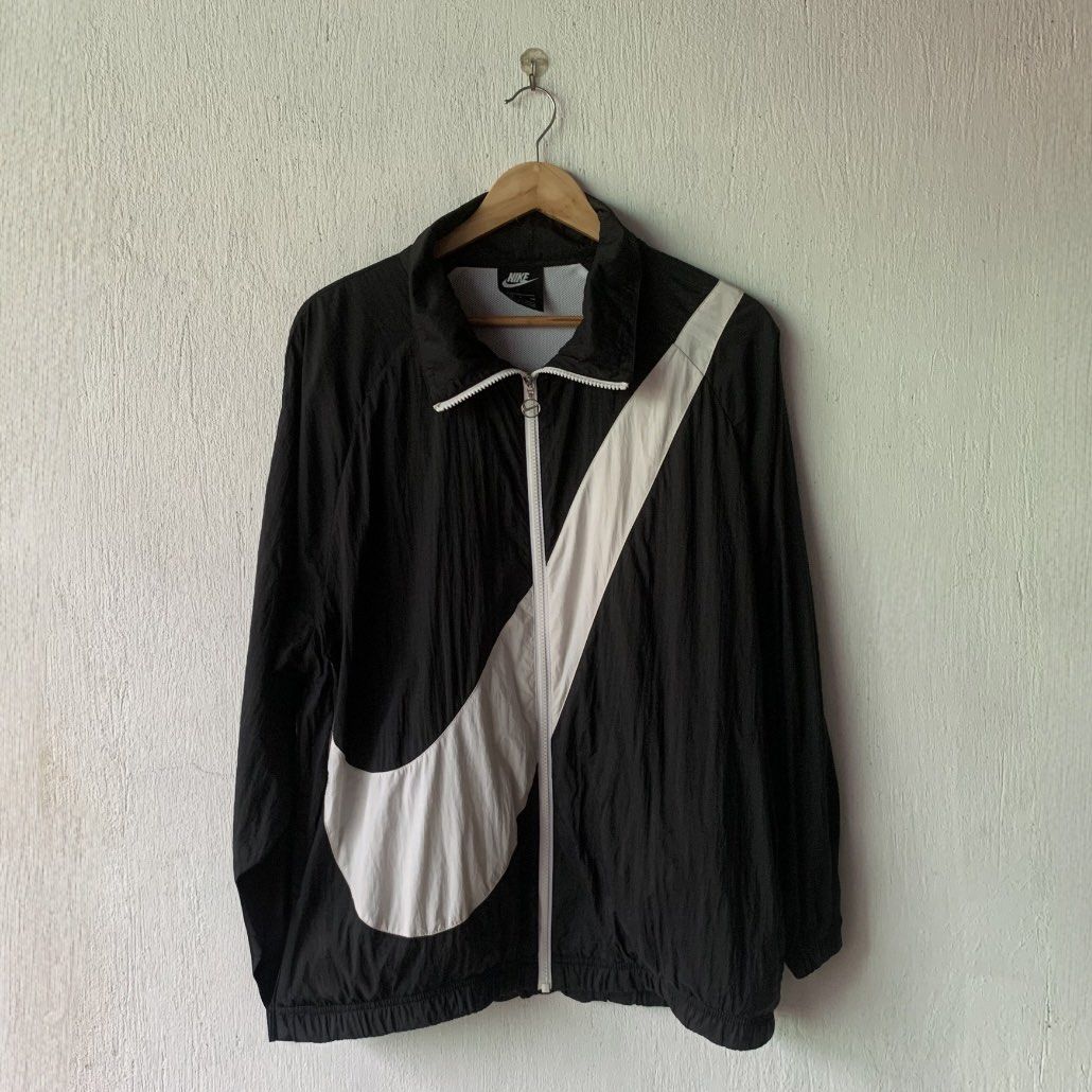 Nike Big Swoosh Windbreaker (Category: Coats, Jackets and Outerwear) located in Bacolod City. Submitted by micojuele68583 (Listing ID 1467352415, Image 1). Description: Size on tag: Medium| Dimes: 23x27 Authentic/Orig/Legit Color rate 10/10 condition: excellent Issue.