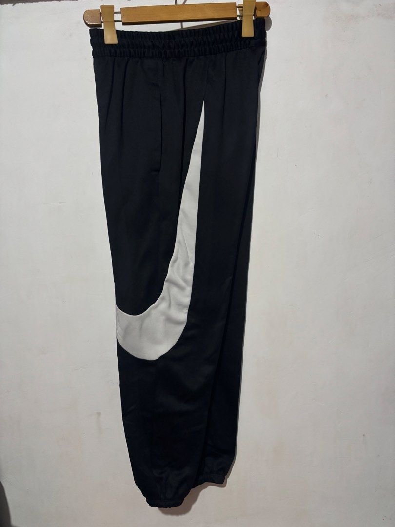 Nike Bigswoosh Jogger (Category: Joggers) located in Subic. Submitted by thriftpoison (Listing ID 1467241439, Image 2). Description: - Brand: Nike - Item: Dri-Fit Joggers - Color: Black with large white swoosh graphic - Size: Small - Waist 30-34 Length 38 - Origin: Made in Vietnam - Features: Comfortable elastic waistband, sweat-wicking Dri-Fit technology - Condition/Use: Great for workouts or casual streetwear.