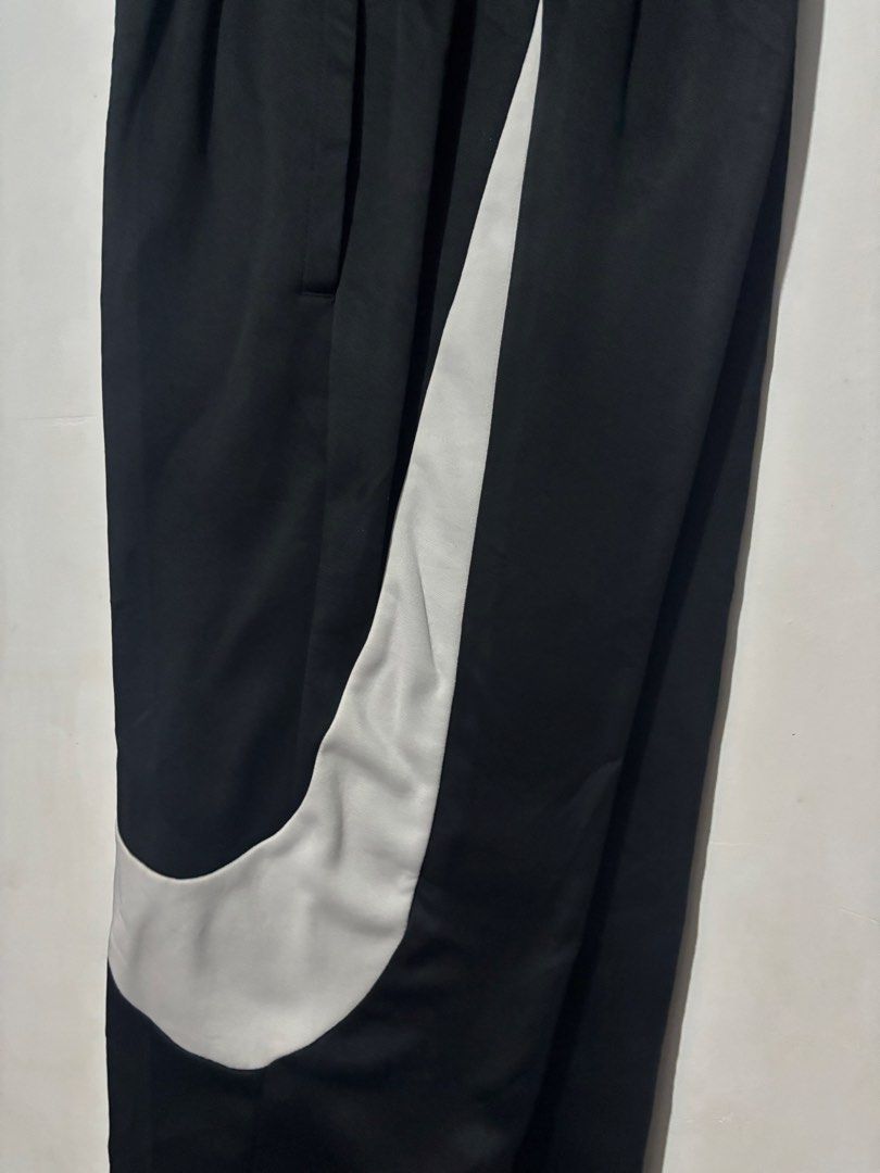 Nike Bigswoosh Jogger (Category: Joggers) located in Subic. Submitted by thriftpoison (Listing ID 1467241439, Image 3). Description: - Brand: Nike - Item: Dri-Fit Joggers - Color: Black with large white swoosh graphic - Size: Small - Waist 30-34 Length 38 - Origin: Made in Vietnam - Features: Comfortable elastic waistband, sweat-wicking Dri-Fit technology - Condition/Use: Great for workouts or casual streetwear.