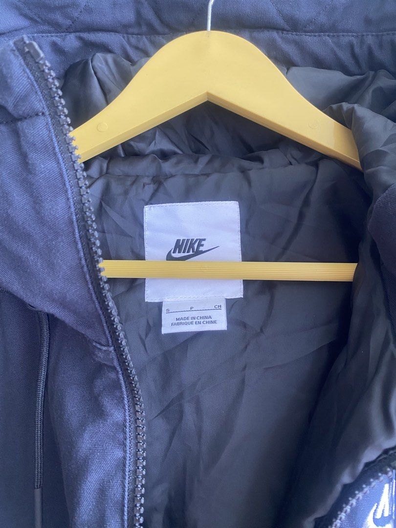 Nike Black Hooded Jacket Cotton Blend Size S (Category: Coats, Jackets and Outerwear) located in Manila. Submitted by anthony1723 (Listing ID 1467193836, Image 3). Description: - Brand: Nike - Color: Classic Black with White Embroidered Logo - Size: Small (Regular Fit) - Material: 100% Cotton body with polyester lining and fill - Features: Full zip-up front, adjustable drawstring hood, ribbed cuffs and hem to lock in warmth - Condition: Excellent