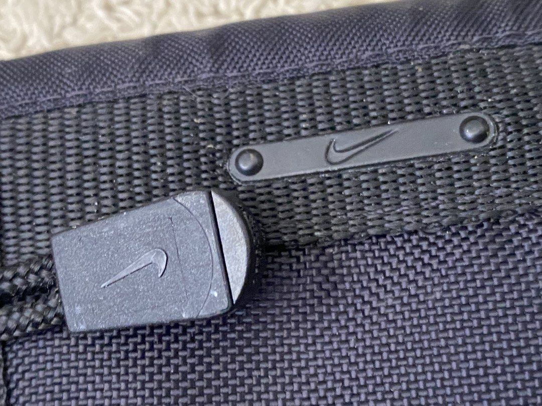 Nike Black Lanyard Tri-fold Wallet (Category: Wallets & Card Holders) located in Baguio. Submitted by SweetRepeat (Listing ID 1467193265, Image 3). Description: - Authentic Black Nike tri-fold wallet made with durable canvas - Secure velcro closure to keep your essentials safe - Multiple interior card slots and slip pockets for easy organization - Includes a detachable neck lanyard with an adjustable toggle cord - Features a handy hook attachment