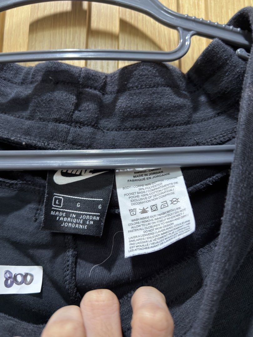 Nike Black Sweatpants Size L (Category: Joggers) located in Bacoor. Submitted by preloved_with_love_ (Listing ID 1467192378, Image 3). Description: - Brand: Nike - Color: Black - Size: L (Waist: ~34", Length: ~39") - Material: Cotton blend (Made in Jordan) - Features: Elastic waistband, adjustable drawstrings, two front pockets - Details: Small Nike logo patch near the left pocket - Condition: Excellent.