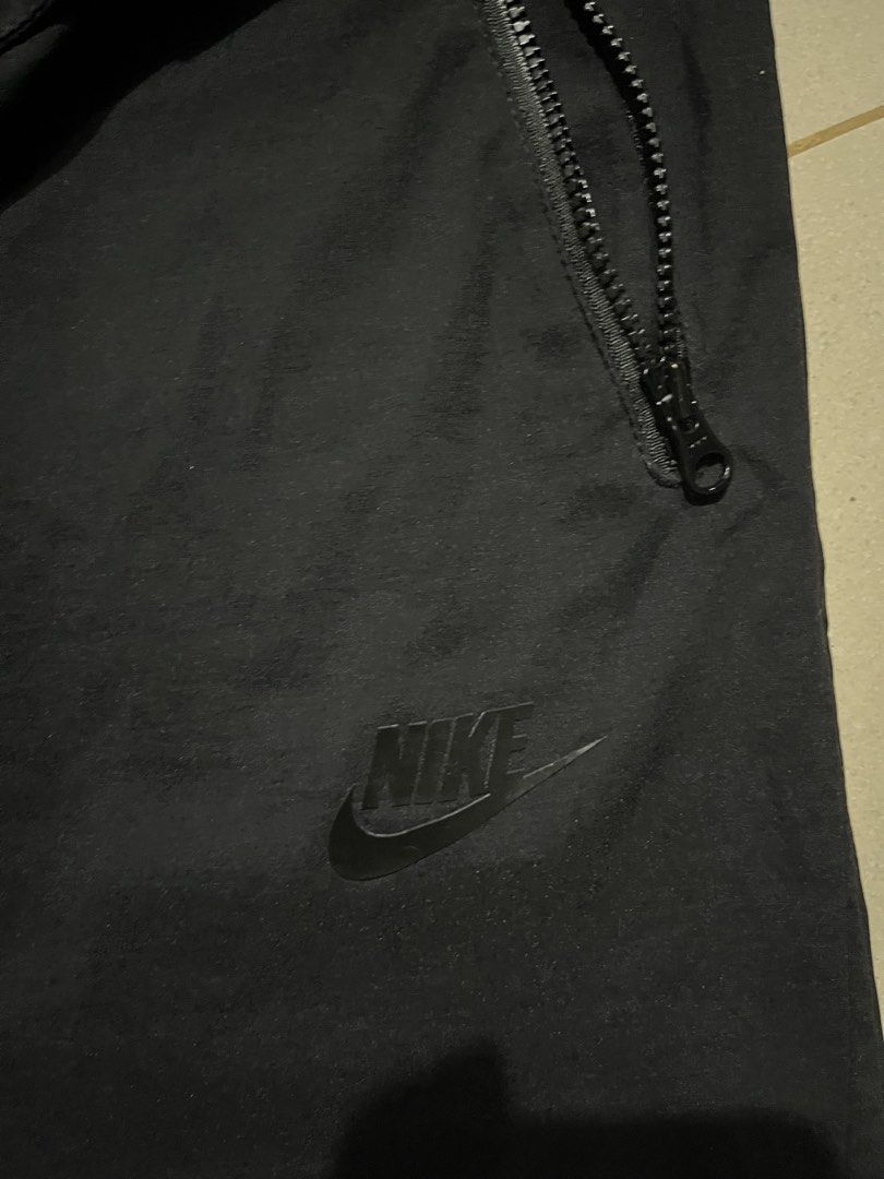 Nike Black Woven Track Pants Size L (Category: Joggers) located in Pasay City. Submitted by Oboyyy (Listing ID 1467253931, Image 2). Description: - Brand: Nike - Color: Black - Size: L - Condition: Clean, no major flaws - Features: Elastic waistband with drawstring, convenient side zip pockets - Origin: Made in China - Versatile: Ideal for workouts or daily casual wear.