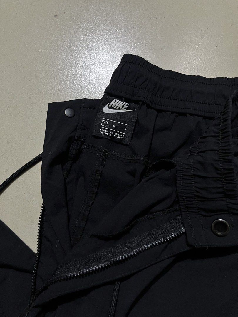 Nike Black Woven Track Pants Size L (Category: Joggers) located in Pasay City. Submitted by Oboyyy (Listing ID 1467253931, Image 3). Description: - Brand: Nike - Color: Black - Size: L - Condition: Clean, no major flaws - Features: Elastic waistband with drawstring, convenient side zip pockets - Origin: Made in China - Versatile: Ideal for workouts or daily casual wear.