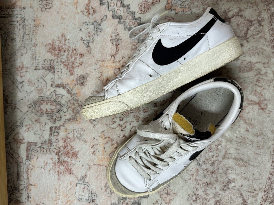Nike Blazer Low '77 Vintage White Black (Category: Sneakers) located in Cebu City. Submitted by penelopetee (Listing ID 1467250614, Image 2). Description: - Colorway: White leather with black swoosh and grey suede overlays - Details: Yellow exposed foam tongue edge and white rubber midsoles with herringbone outsoles - Condition: Minor wear on soles and insoles from previous use - Inclusions: Comes with original white laces - DM for inquiries or f