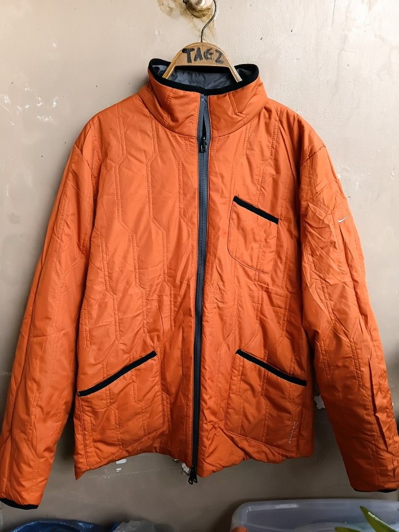 Nike Clima-Fit Reversible Grey and Orange Jacket Size L (Category: Coats, Jackets and Outerwear) located in Manila. Submitted by grandflower-547aee (Listing ID 1467287334, Image 2). Description: - Brand: Nike - Style: Clima-Fit Reversible Jacket (Grey / Vibrant Orange) - Size: L (Made in China) - Material: 100% polyester (outer body, inner body, and fill) - Features: Zip-up front, zipped pockets on both sides, and embroidered Nike swoosh logo - C