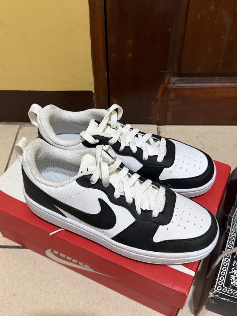 Nike Court Bourough Low Recraft (Category: Sneakers) located in Las Pinas. Submitted by sae_reiah (Listing ID 1467301656, Image 1). Description: - Classic black and white Nike sneakers - Versatile everyday colorway that matches any casual outfit - Breathable perforated toe box for airflow - Secure lace-up closure with white laces - Stylish low-top skater cut - Comes in the original red Nike shoebox.