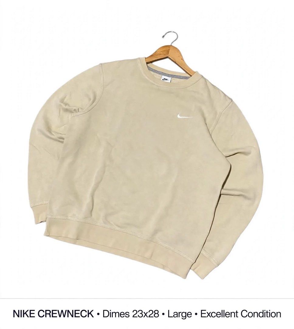 NIKE CREWNECK Dimes 23x28 Large (Category: Coats, Jackets and Outerwear) located in Lucena. Submitted by jestonioab55753 (Listing ID 1467294251, Image 1). Description: - Brand: Nike - Color: Beige / Neutral - Size: Men's Large (Pit-to-pit: 23", Length: 28") - Details: Small embroidered white swoosh on chest, ribbed cuffs and hem - Style: Classic streetwear staple, easy to match - Condition: Clean and ready to wear.