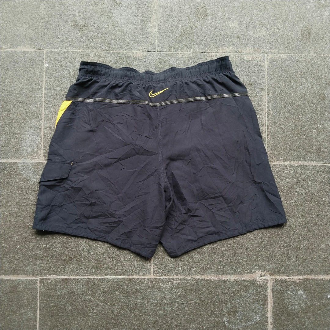 Nike Dark Grey/Gold Logo Boardshorts (Category: Swim Trunks & Board Shorts) located in Munoz. Submitted by ukay.kay.jay (Listing ID 1467204048, Image 2). Description: Brand: Nike Condition: 8.5/10 Color Rate: 9/10 Issue: Pinhole (see pic) Extra Info: Comfortable, Aesthetic, Interior Mesh in Perfect condition, Pocket in Excellent Condition Dimes: 30-36 in Waist (Adjustable Waistline), 18 in Outseam, 7 in Inseam, 13 in Leg Opening Price: 400+sf (Al
