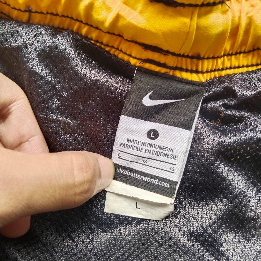 Nike Dark Grey/Gold Logo Boardshorts (Category: Swim Trunks & Board Shorts) located in Munoz. Submitted by ukay.kay.jay (Listing ID 1467204048, Image 3). Description: Brand: Nike Condition: 8.5/10 Color Rate: 9/10 Issue: Pinhole (see pic) Extra Info: Comfortable, Aesthetic, Interior Mesh in Perfect condition, Pocket in Excellent Condition Dimes: 30-36 in Waist (Adjustable Waistline), 18 in Outseam, 7 in Inseam, 13 in Leg Opening Price: 400+sf (Al