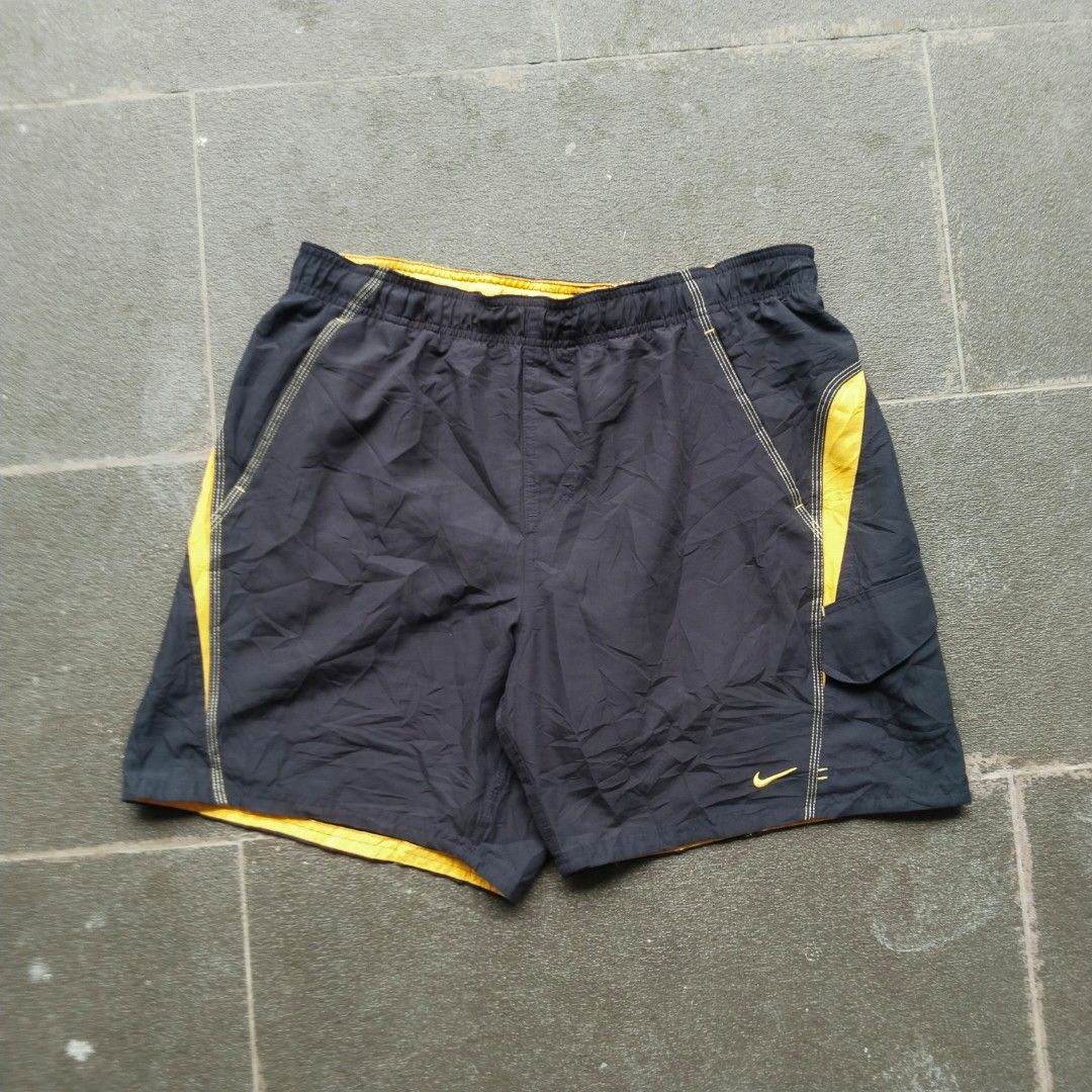 Nike Dark Grey/Gold Logo Boardshorts (Category: Swim Trunks & Board Shorts) located in Munoz. Submitted by ukay.kay.jay (Listing ID 1467204048, Image 1). Description: Brand: Nike Condition: 8.5/10 Color Rate: 9/10 Issue: Pinhole (see pic) Extra Info: Comfortable, Aesthetic, Interior Mesh in Perfect condition, Pocket in Excellent Condition Dimes: 30-36 in Waist (Adjustable Waistline), 18 in Outseam, 7 in Inseam, 13 in Leg Opening Price: 400+sf (Al