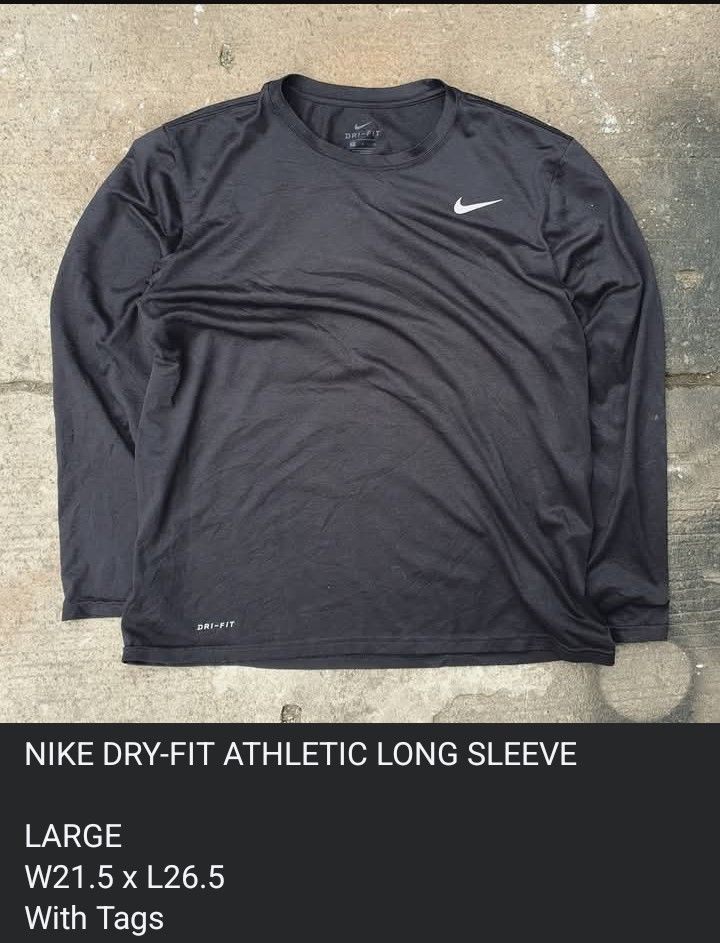 Nike Dri-Fit Athletic Long Sleeve Black Large (Category: Activewear) located in Cavite. Submitted by josephnl (Listing ID 1467350254, Image 3). Description: - Brand: Nike - Item: Athletic Long Sleeve Shirt - Color: Classic Black with Swoosh logo - Technology: Dri-Fit lightweight performance material - Neckline: Crew neck - Size: Large - Perfect for workouts, sports, or casual everyday wear.