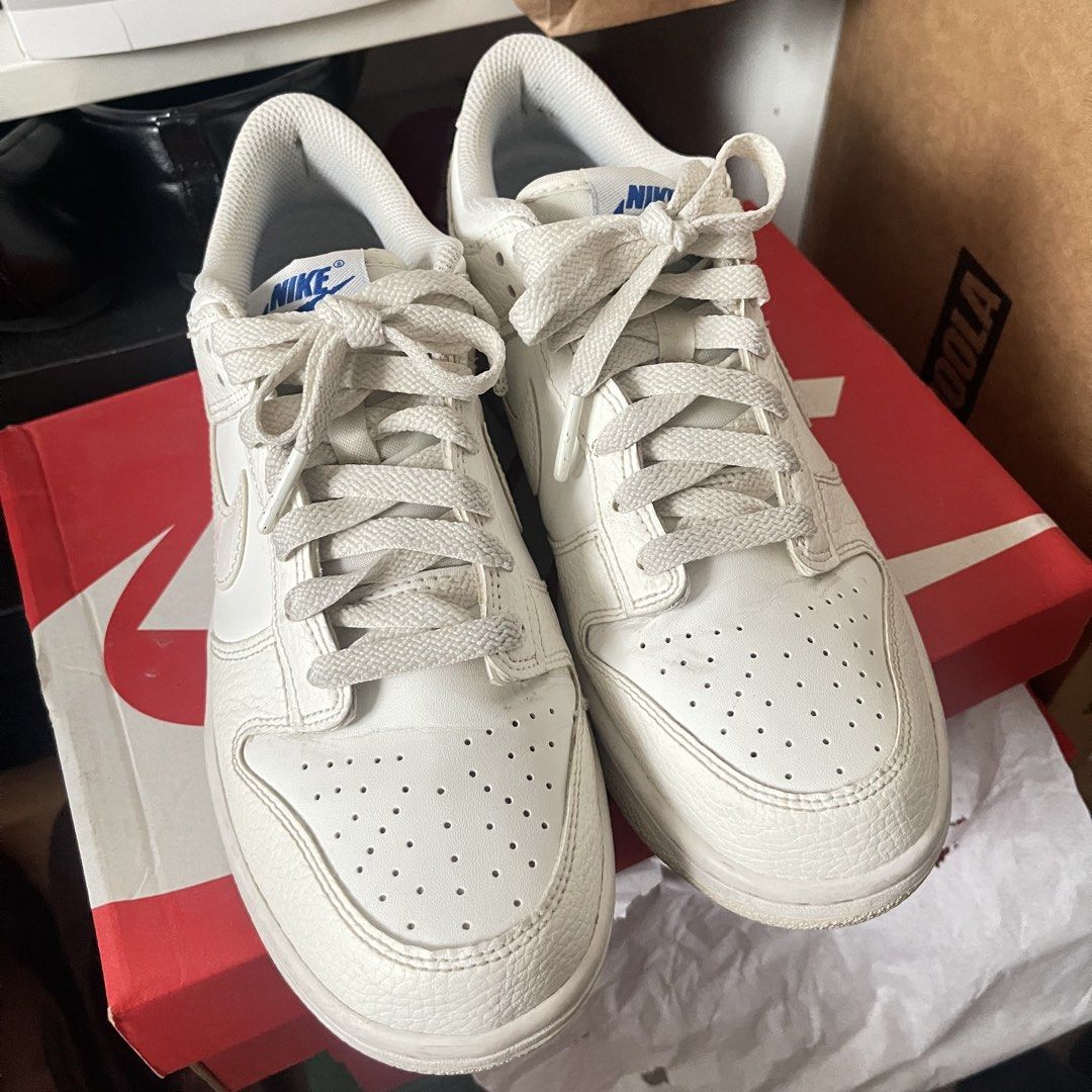Nike Dunk Low SE GS US 8 Sail White Game Royal (Category: Sneakers) located in Muntinlupa City. Submitted by sza1123 (Listing ID 1467171321, Image 1). Description: - Model: Nike Dunk Low - Colorway: Sail, White, and Game Royal - Size: 7Y (Grade School) US 8 - Details: Textured leather overlays, blue tongue branding, royal blue insoles, and white laces - Inclusion: Complete with original red Nike shoebox - Shipping: Can ship nationwide via J&T (bu