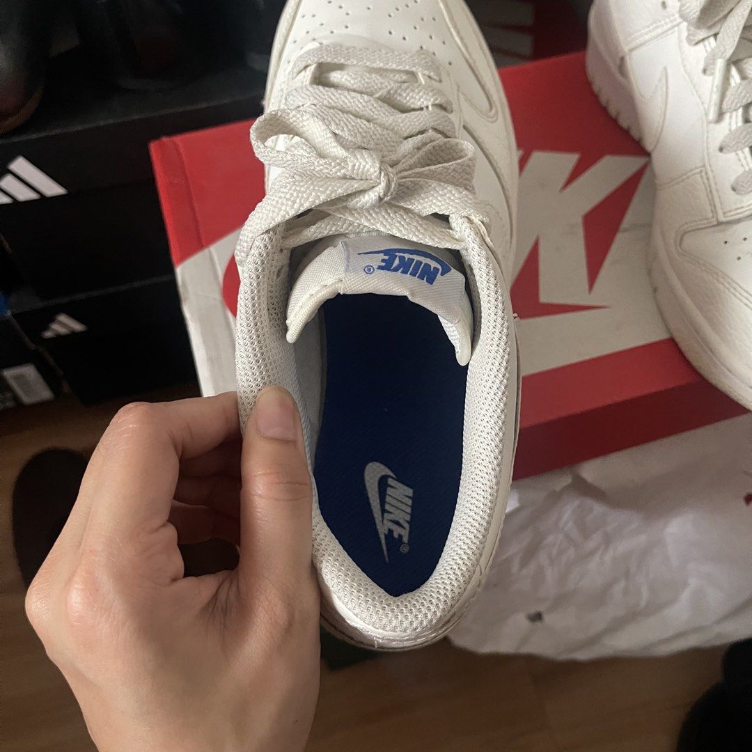 Nike Dunk Low SE GS US 8 Sail White Game Royal (Category: Sneakers) located in Muntinlupa City. Submitted by sza1123 (Listing ID 1467171321, Image 3). Description: - Model: Nike Dunk Low - Colorway: Sail, White, and Game Royal - Size: 7Y (Grade School) US 8 - Details: Textured leather overlays, blue tongue branding, royal blue insoles, and white laces - Inclusion: Complete with original red Nike shoebox - Shipping: Can ship nationwide via J&T (bu