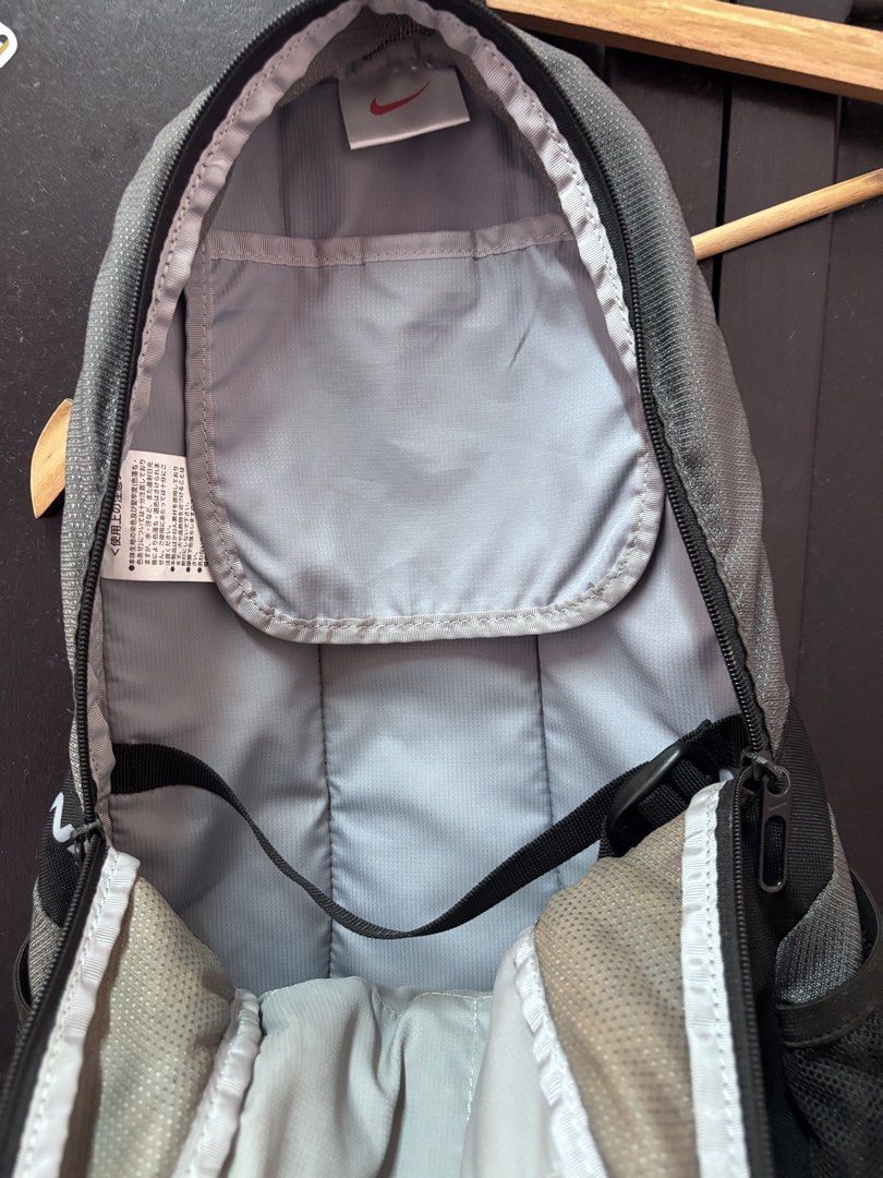 Nike grey and black backpack (Category: Backpacks) located in Quezon. Submitted by vintageshorks (Listing ID 1467199255, Image 3). Description: Vintage nike bag Size Medium - Brand: Nike - Color: Grey and black with lime green zippers and accents - Storage: Main compartment with internal slip pocket and dual mesh side pockets - Comfort: Adjustable shoulder straps - Ideal Use: Great everyday bag for school, work, or the gym.