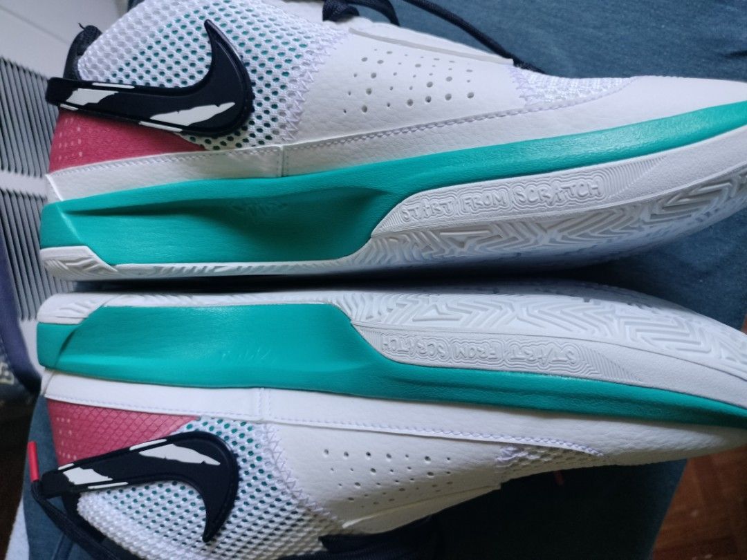 Nike Ja 1 Scratch Basketball Shoes (Category: Sneakers) located in Pasay City. Submitted by bigitogarc30663 (Listing ID 1467175609, Image 2). Description: - Model: Nike Ja 1 Basketball Shoes - Colorway: White, Teal, and Pink with black scratch graphics - Size: US 8 - Features: Air Zoom cushioning and signature Ja Morant branding - Outsole: White textured sole with 'START FROM SCRATCH' text - Condition: Clean uppers and pristine outsoles, fresh an