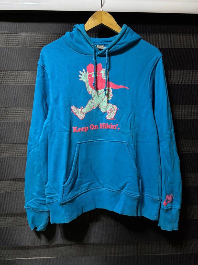 Nike Keep On Hikin Blue Hoodie (Category: Coats, Jackets and Outerwear) located in Pasig City. Submitted by abogadosupremo (Listing ID 1467346052, Image 1). Description: - Cool blue Nike hoodie - Features 'Keep On Hiking' graphic print - Small Nike logo on the sleeve - Ideal for casual wear - Please check photos for detailed condition - 100% Legit and Authentic - Very Good Condition - Color may vary due to lighting - No issue at all - Size : Can 