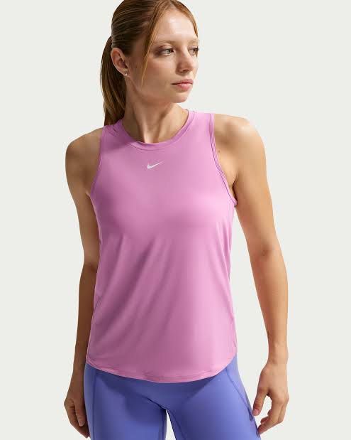 Nike one drifit tabk top large (Category: Activewear) located in Iba. Submitted by xooperfindslb (Listing ID 1467324395, Image 1). Description: Nike one drifit tank top Pink Large on tag Chest width when laid flat - 15.5 inches No issue Like new.