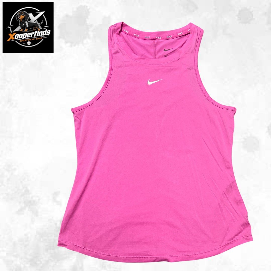 Nike one drifit tabk top large (Category: Activewear) located in Iba. Submitted by xooperfindslb (Listing ID 1467324395, Image 2). Description: Nike one drifit tank top Pink Large on tag Chest width when laid flat - 15.5 inches No issue Like new.