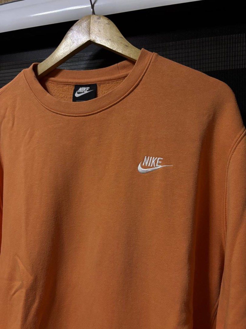 Nike Orange Crewneck Sweatshirt (Category: Coats, Jackets and Outerwear) located in Pasig City. Submitted by abogadosupremo (Listing ID 1467352876, Image 2). Description: - Classic orange Nike crewneck sweatshirt - Features a small embroidered Nike logo on the chest - Ideal for casual wear - Offers both comfort and style - 100% Legit and Authentic - Very Good Condition - Color may vary due to lighting - No issue at all - Size : Can fit to L to XL