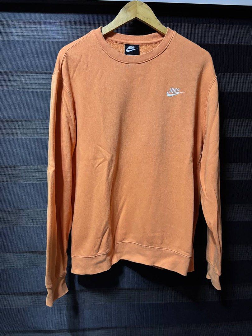 Nike Orange Crewneck Sweatshirt (Category: Coats, Jackets and Outerwear) located in Pasig City. Submitted by abogadosupremo (Listing ID 1467352876, Image 1). Description: - Classic orange Nike crewneck sweatshirt - Features a small embroidered Nike logo on the chest - Ideal for casual wear - Offers both comfort and style - 100% Legit and Authentic - Very Good Condition - Color may vary due to lighting - No issue at all - Size : Can fit to L to XL