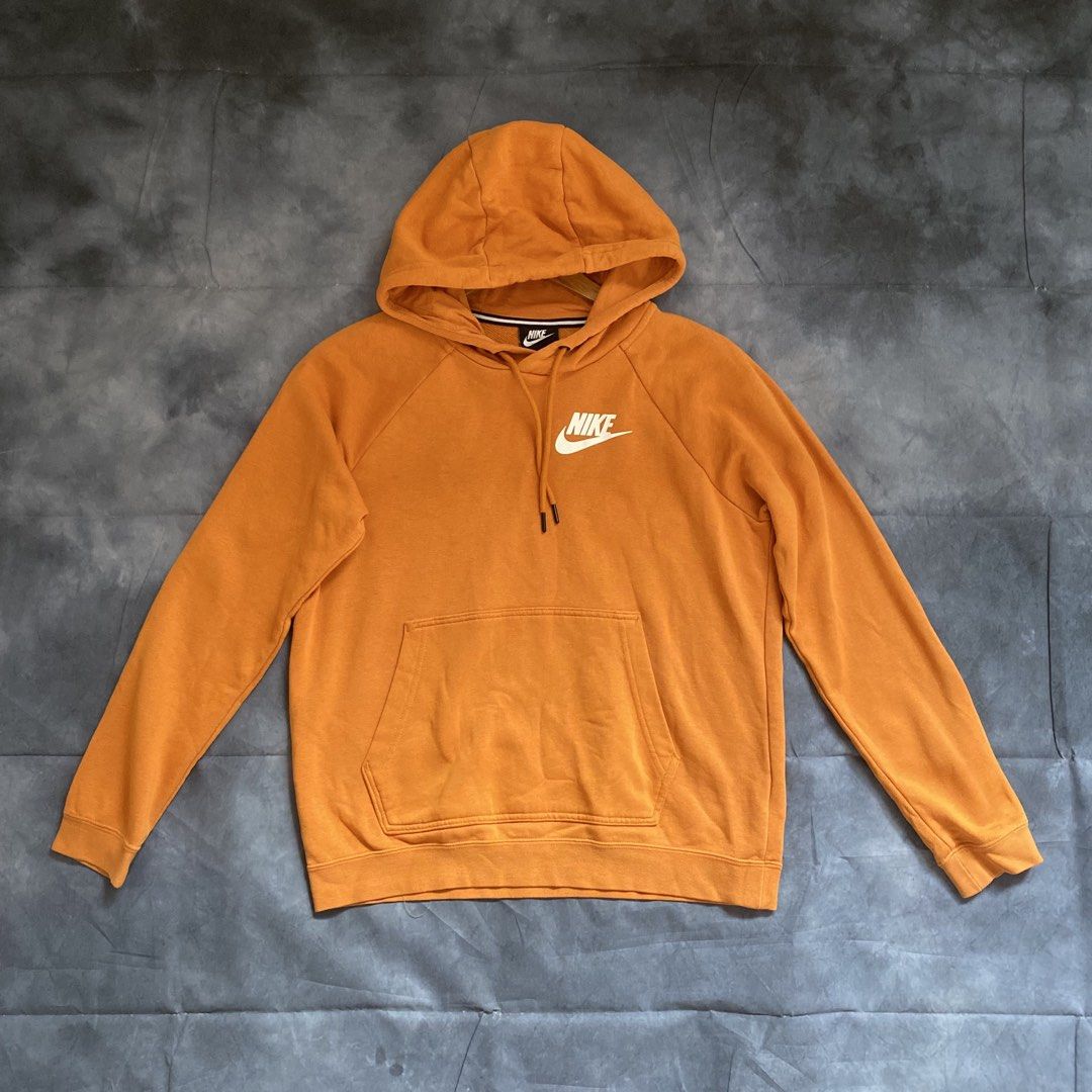 Nike Orange Hoodie Size M (Category: Coats, Jackets and Outerwear) located in Manila. Submitted by seramisu (Listing ID 1467349867, Image 1). Description: - Brand: Nike - Color: Orange with white chest logo - Size: Medium (Made in China) - Fit: Regular - Material: Cotton and polyester blend - Features: Front kangaroo pocket, adjustable drawstring hood - Condition: Great for everyday casual wear.