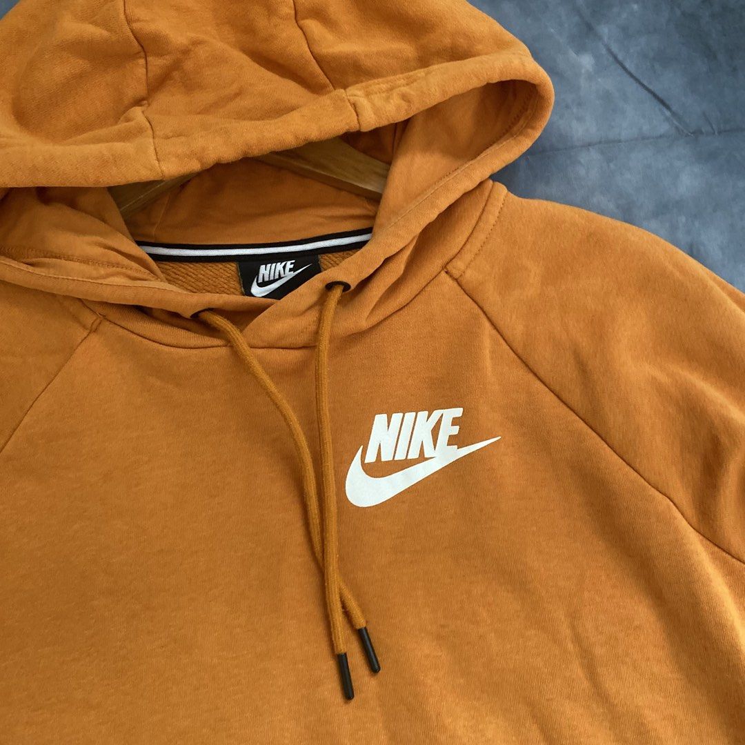 Nike Orange Hoodie Size M (Category: Coats, Jackets and Outerwear) located in Manila. Submitted by seramisu (Listing ID 1467349867, Image 2). Description: - Brand: Nike - Color: Orange with white chest logo - Size: Medium (Made in China) - Fit: Regular - Material: Cotton and polyester blend - Features: Front kangaroo pocket, adjustable drawstring hood - Condition: Great for everyday casual wear.
