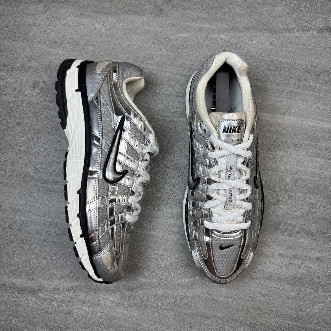 Nike P-6000 Metallic Silver Black (Category: Sneakers) located in Manolo Fortich. Submitted by thrift_by_biji (Listing ID 1467266796, Image 2). Description: - Brand: Nike - Model: P-6000 - Colorway: Metallic Silver and Black - Style: Retro track-inspired design with breathable mesh upper and glossy metallic overlays - Comfort: Cushioned collar and chunky white midsole, perfect for daily rotation - Condition: Great overall, with very minor/slight 