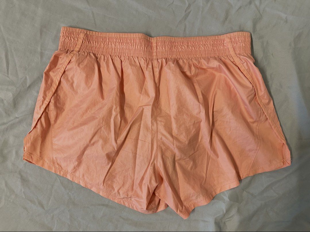 Nike Peach Running Shorts (Category: Shorts) located in Mandaluyong City. Submitted by kjannah (Listing ID 1467203018, Image 2). Description: Brand: Nike Color: Peach pink Size: Medium *Color may vary due to lighting. *No return, no refund policy.
