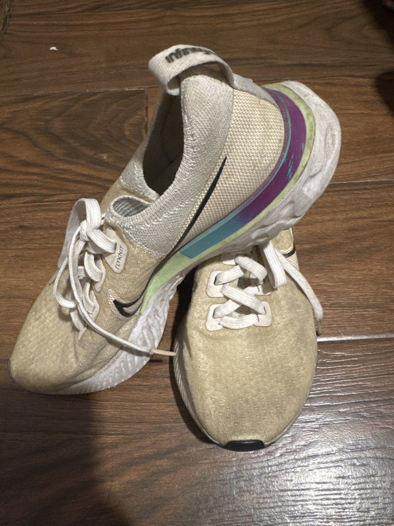 Nike React Infinity Run Flyknit (Category: Sneakers) located in Manila. Submitted by jeanyny (Listing ID 1467317021, Image 1). Description: - Brand: Nike - Model: React Infinity Run Flyknit - Style Code: CD4372-102 - Colorway: Cream knit upper with purple, blue, and lime green heel clip - Sole: White React foam midsole with durable black outsole - Size: US 8.5 | UK 6 | EUR 40 | CM 25.5 - Condition: Excellent / Pre-loved (Made in Vietnam) - Featur