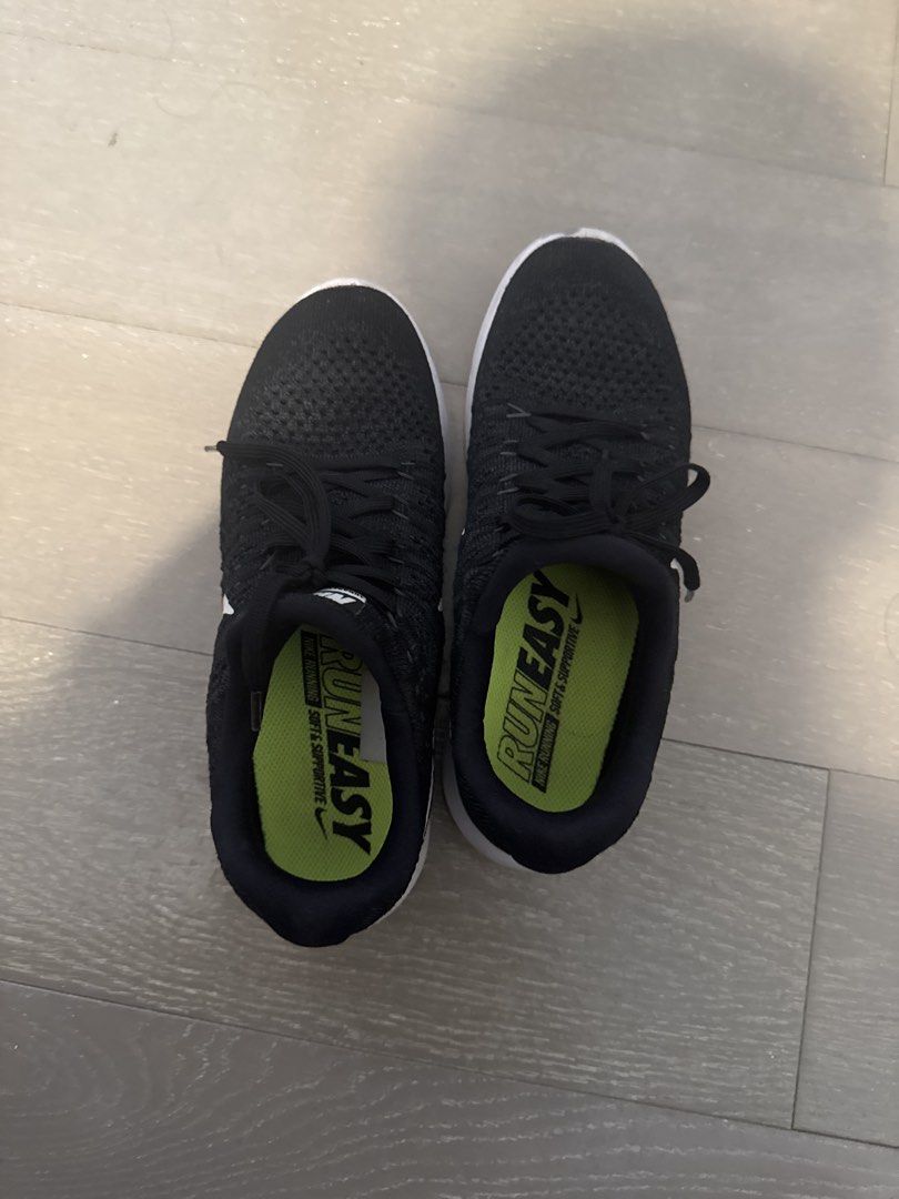 Nike Run Easy Black Running Shoes (Category: Sneakers) located in Makati City. Submitted by plitz13 (Listing ID 1467246552, Image 1). Description: - Brand: Nike - Color: Black with neon green insoles and white midsoles - Material: Breathable knit upper for cool and comfortable wear - Design: 'Run Easy' and 'soft & supportive' branding on insoles - Condition: Clean, minimal wear on soles and fabric - Best For: Daily runs, workouts, or casual walki