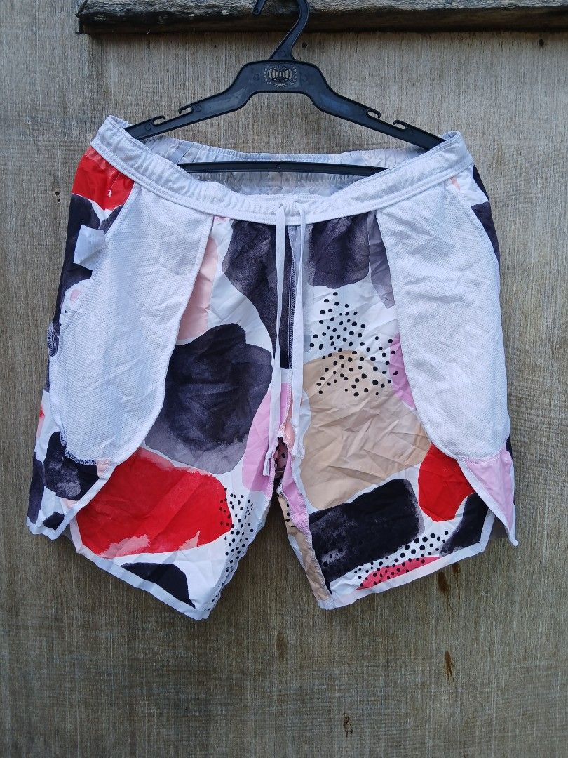 Nike Shorts BV0796-100 Size M (Category: Shorts) located in Manila. Submitted by thrift_sixty (Listing ID 1467183632, Image 3). Description: - Brand: Nike - Design: Colorful abstract pattern with dots - Size: Medium (tag attached) - Material: 100% polyester (Made in Vietnam) - Features: Elastic waistband with adjustable drawstring and white mesh pocket bags - Care Instructions: Wash inside out, do not use softeners.
