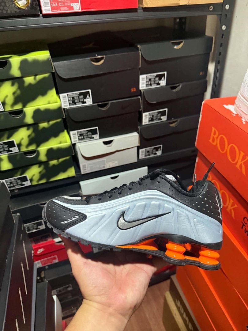 Nike Shox R4 (Category: Sneakers) located in Manila. Submitted by rmolde.0424 (Listing ID 1467262967, Image 3). Description: - Authentic Nike Shox TL sneakers in a striking black, ice blue, and bright orange colorway - Full-length mechanical cushioning columns at the heel for maximum comfort and impact absorption - Breathable mesh upper reinforced with TPU overlays and reflective details for visibility - Textured rubber outsole delivers reliable,