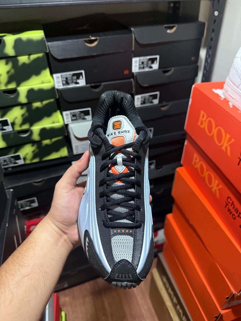 Nike Shox R4 (Category: Sneakers) located in Manila. Submitted by rmolde.0424 (Listing ID 1467262967, Image 2). Description: - Authentic Nike Shox TL sneakers in a striking black, ice blue, and bright orange colorway - Full-length mechanical cushioning columns at the heel for maximum comfort and impact absorption - Breathable mesh upper reinforced with TPU overlays and reflective details for visibility - Textured rubber outsole delivers reliable,