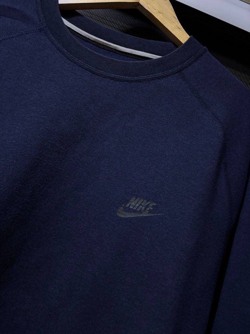 Nike Techfleece Navy Blue Sweatshirt Crewneck (Category: Coats, Jackets and Outerwear) located in Pasig City. Submitted by abogadosupremo (Listing ID 1467352173, Image 2). Description: - Classic navy blue Nike Techfleece sweatshirt - Comfortable raglan sleeves - Convenient front pocket - Simple Nike logo on chest - Ideal for casual wear or layering - Versatile and easy to pair with any outfit - 100% Legit and Authentic - Very Good Condition - Col