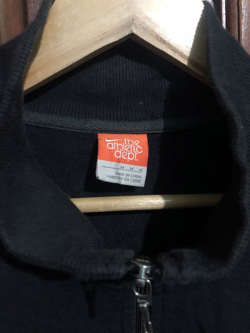Nike The Athletic Dept Track & Field Zip Jacket (Category: Coats, Jackets and Outerwear) located in Quezon City. Submitted by yeahsource222 (Listing ID 1467241890, Image 3). Description: - Brand: Nike - Type: Full-zip jacket - Color: Black - Size: Medium - Details: Orange Athletic Dept tag, small front swoosh, large back swoosh with 'Track & Field EST. 72' graphic - Material: Comfortable cotton blend - Condition: Good - Best for: Casual wear or t