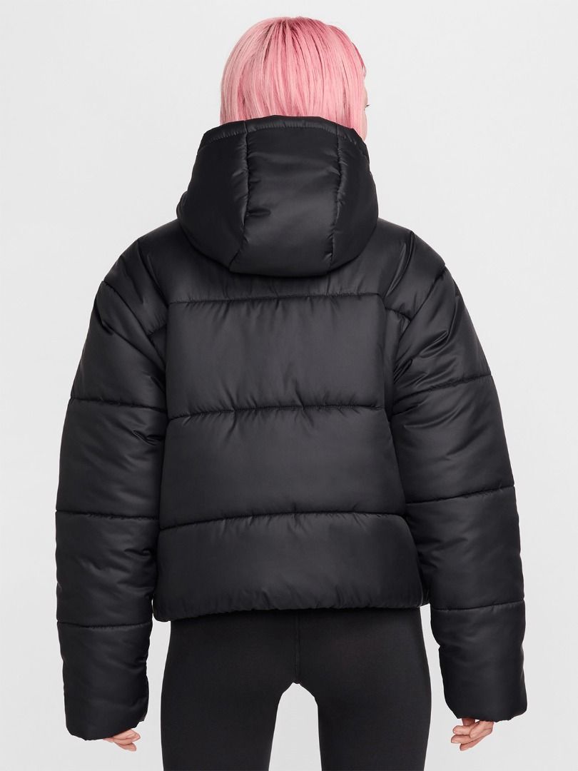 Nike Therma-FIT Black Puffer Jacket (Women's) (Category: Coats, Jackets and Outerwear) located in Pasig City. Submitted by p.re.loved (Listing ID 1467268570, Image 2). Description: - Nike black puffer jacket with Therma-FIT technology - Super warm and cozy, perfect for cold weather and winter - Full zip front with an attached hood - Convenient side pockets for your hands - Clean, versatile design that matches any outfit - Features an embroidered 