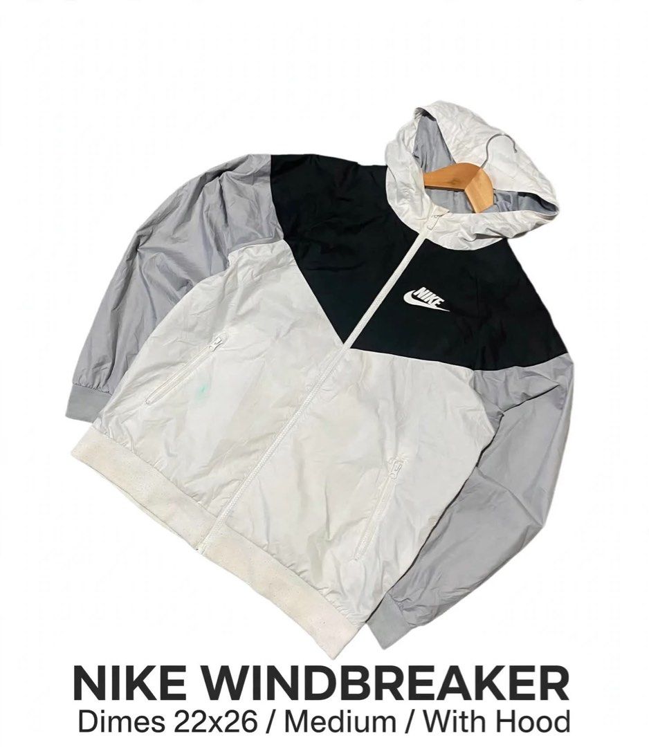 Nike Windbreaker Jacket Medium Black White Grey Hooded (Category: Coats, Jackets and Outerwear) located in Lucena. Submitted by jestonioab55753 (Listing ID 1467294092, Image 1). Description: - Brand: Nike - Style: Windbreaker jacket with attached hood - Colorway: Black, white, and grey - Size: Men's Medium (22" chest x 26" length) - Features: Full zip closure and dual front zip pockets - Material: Lightweight, ideal for breezy weather - Condition